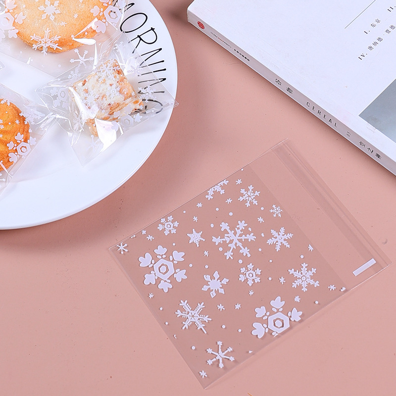 100个圣诞白色雪花酥饼干袋透明糖果袋礼品袋自粘袋手工皂塑料袋