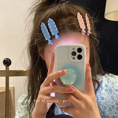 A mermaid princess candy-colored metal wavey fringe hair clip with side bangs and invisible hair clip