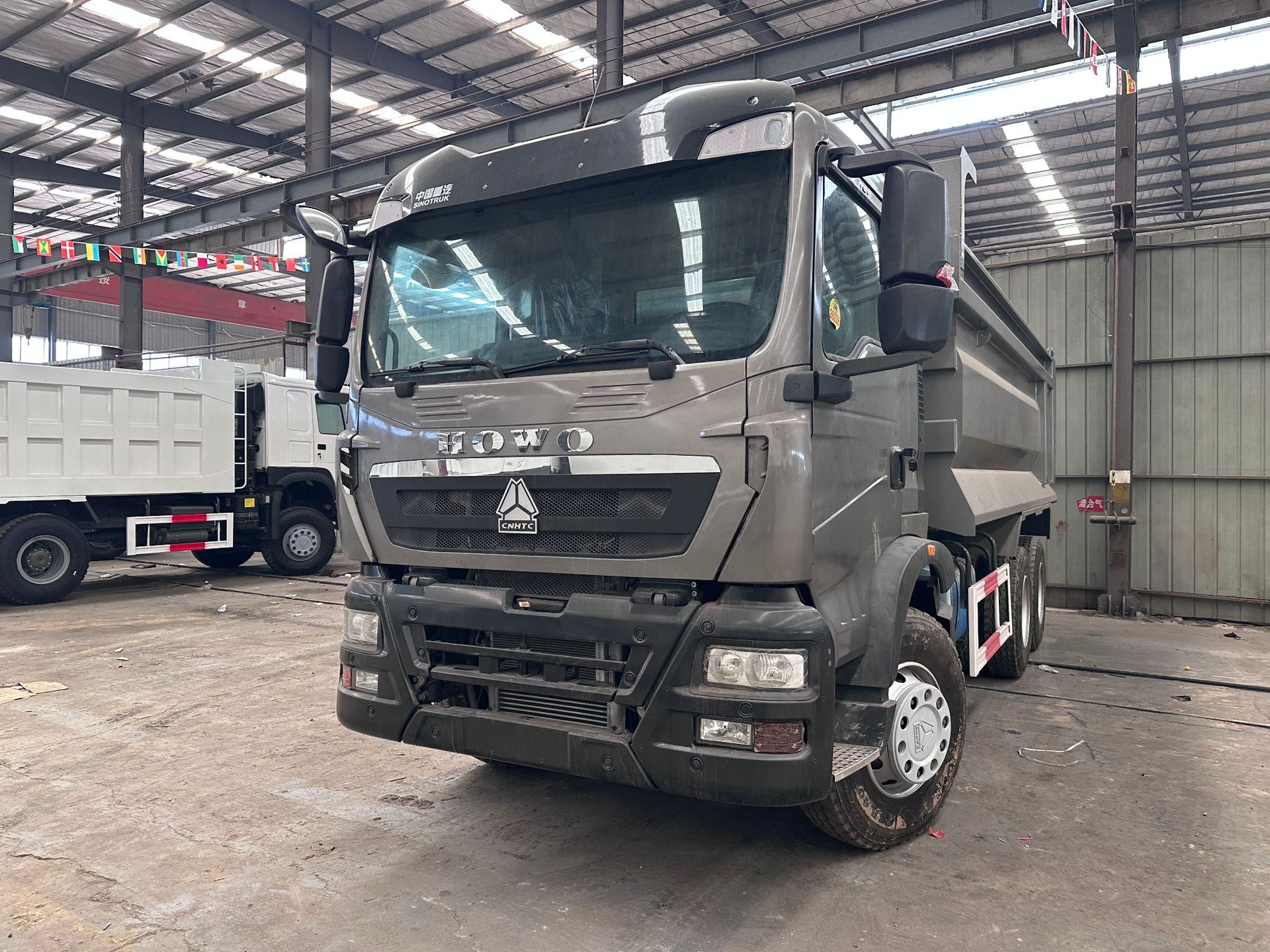 Factory direct cross-border sales of left-hand drive Sinotruk Howo TX371 6*4 dump truck for transporting soil, ore, sand, and gravel