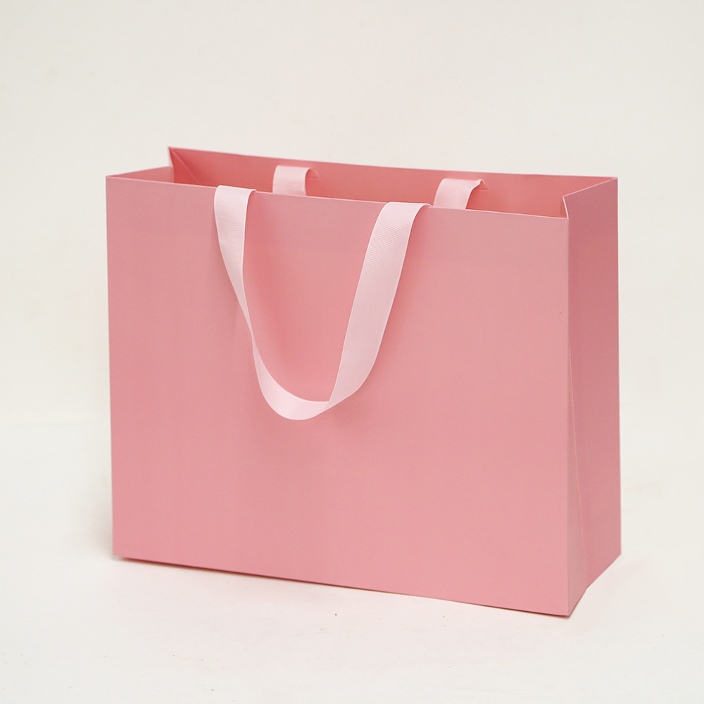 Bolsa de cartón blanco logotipo tienda de ropa bolsa de mano bolsa de regalo espesa bolsa de regalo de Navidad se puede imprimir