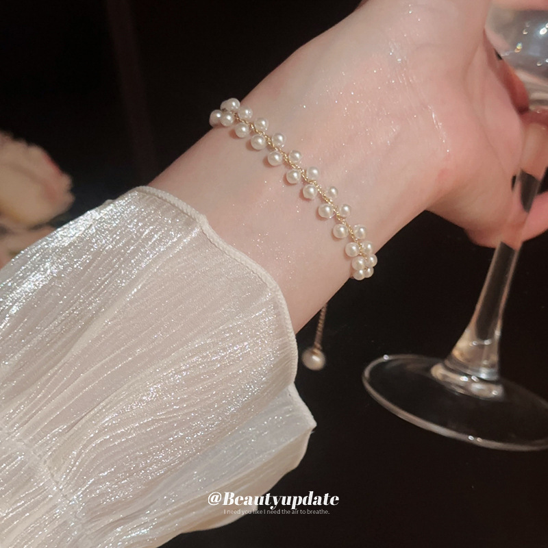 Pulsera tejida de perlas de doble hilera francesa, lujo ligero, pulsera exquisita de moda de alta gama, nueva joyería de todo fósforo, venta al por mayor femenina