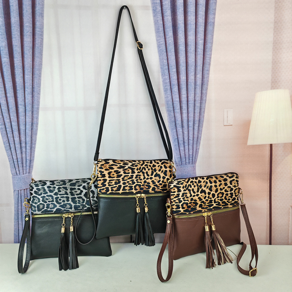 Bolso de leopardo de mujer bolso de moda europeo y americano nuevo bolso inclinado de hombro único bolso de color de choque ultrafino bolso de mano con borlas