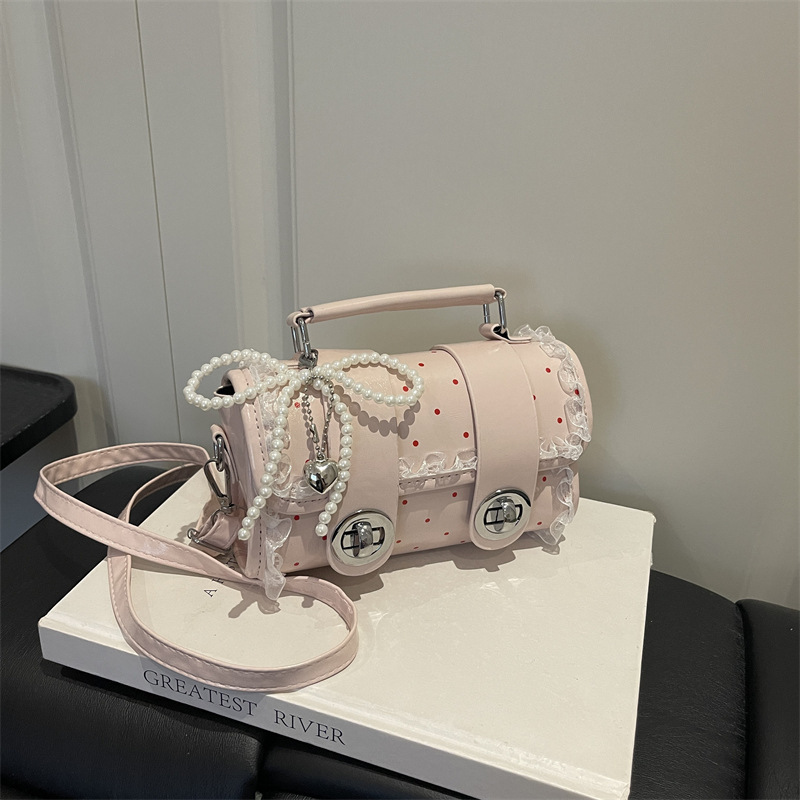 Korean-style cream-colored Boston handbag with unique design, plush pendant, versatile for dating and commuting, women's bag