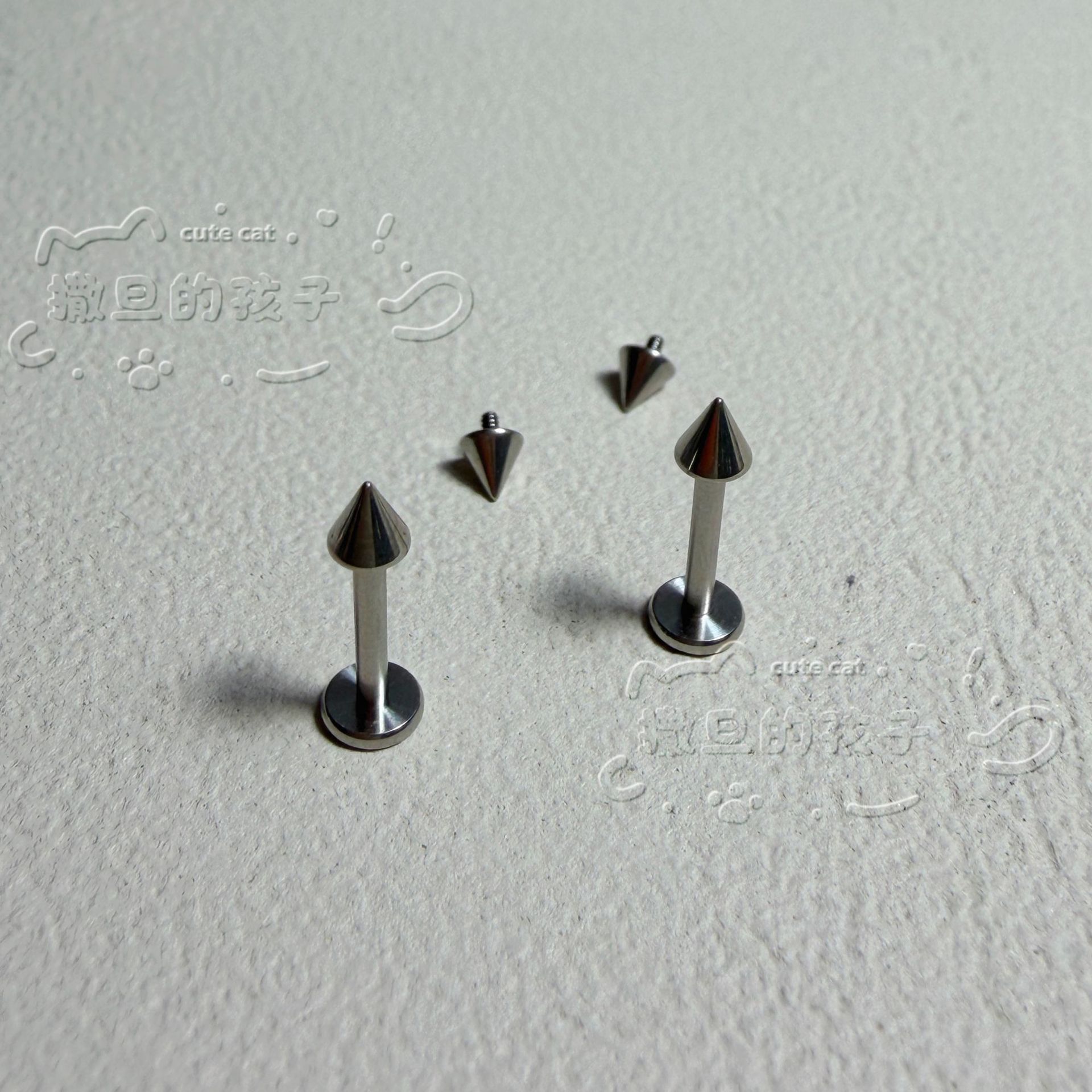 Silver pointed spike labret stud material detail