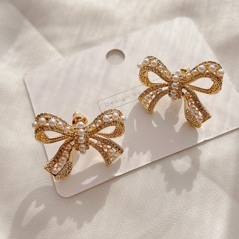 Micro-inlaid Pearl Bow Earrings display picture 2