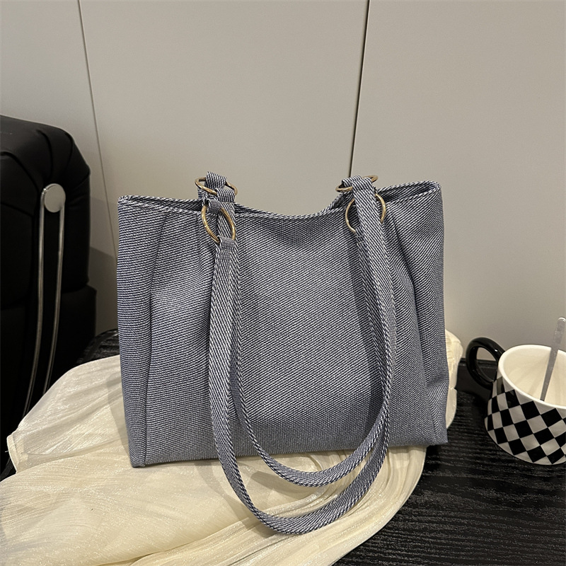 Bolsa de textura para mujeres de gran capacidad 2025 nueva primavera y verano ocio rayas bolsas de compras de hombro para clase de viaje bolsa