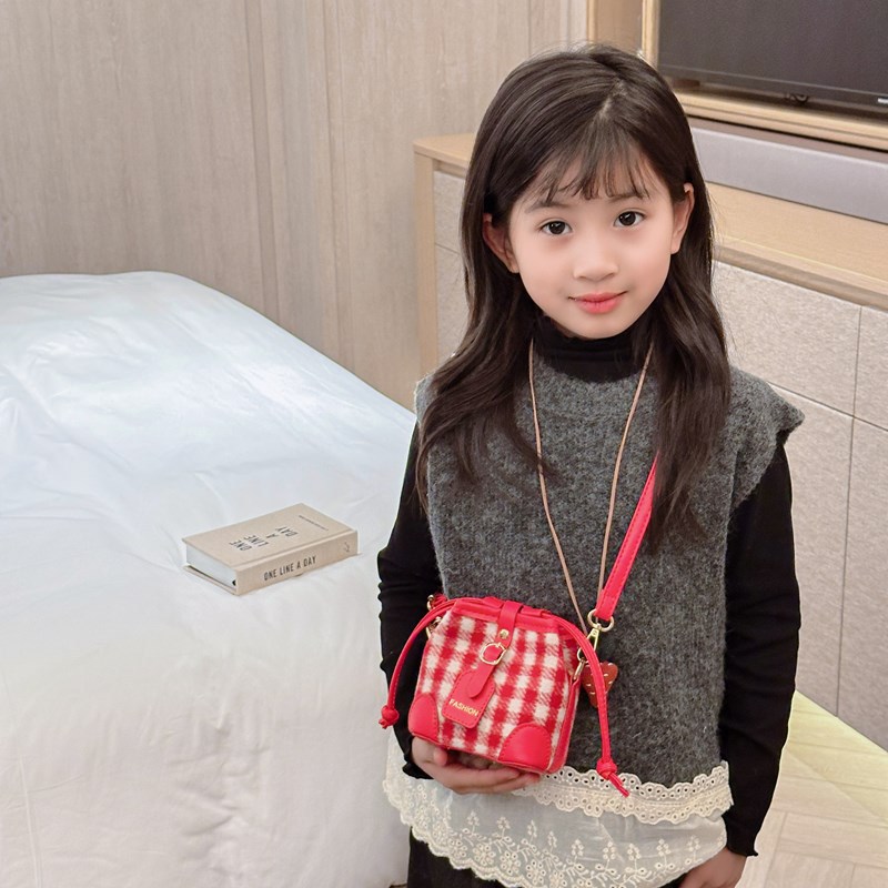 2025 nuevo bolso infantil de moda coreana estampado leopardo para niños y niñas bolso de cubo de aire a placas extranjeras bolso de cambio de bebé