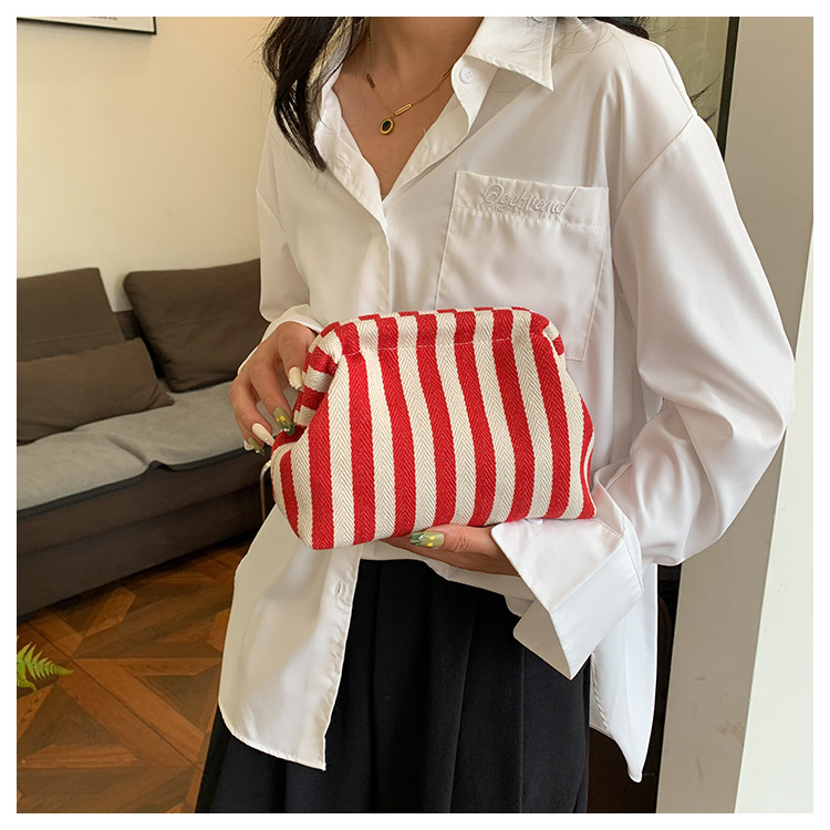 New cross-border fashion color-blocking striped cosmetic bag, women's loose change mobile phone storage bag, trendy and niche cloud clutch undefined