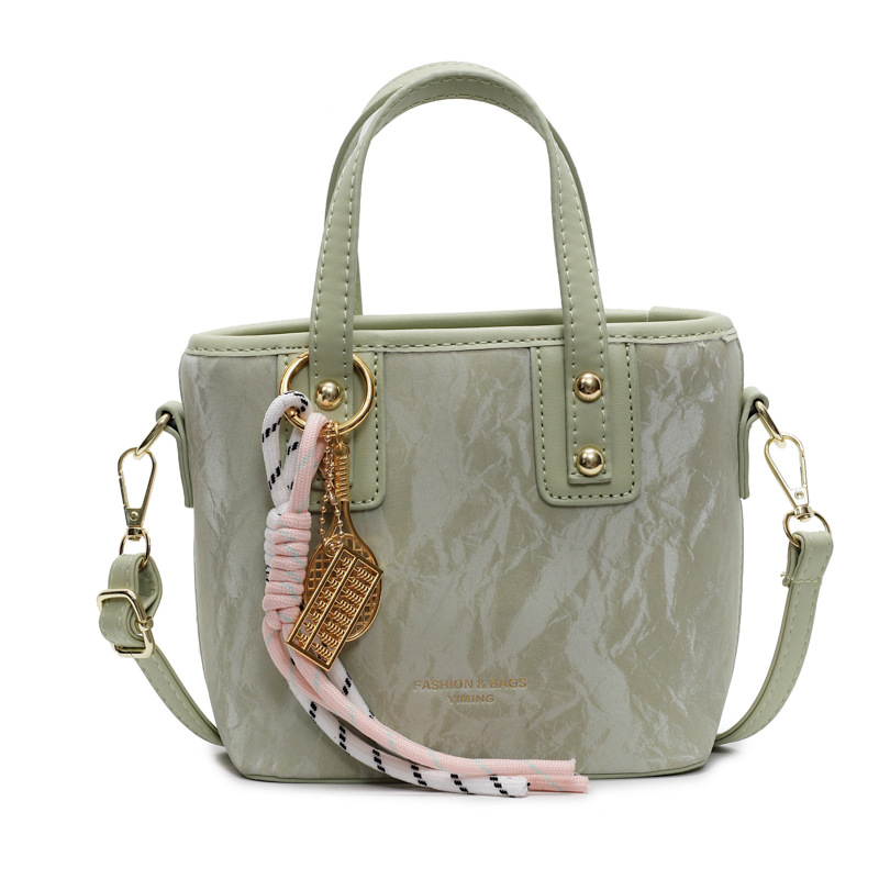 Comercio exterior explosión bolso de cubo de mano mujer 2025 nuevo simple bolso de hombro casual red explosión bolso de mochila coreano