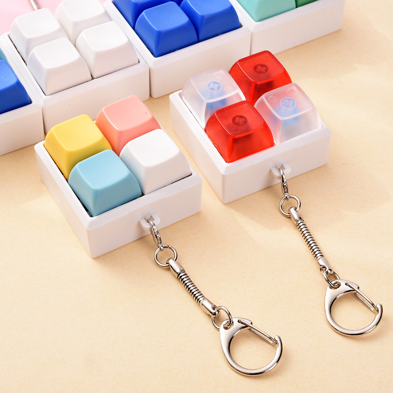 Cross-border creative stress-relief four-button keychain pendant, a gadget for stress reduction and boredom relief Cross-border creative stress-relief four-button keychain pendant, a gadget for stress reduction and boredom relief