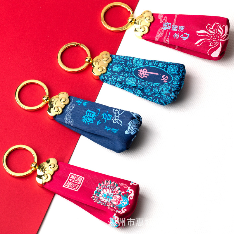 Factory wholesale Zen keychain artificial silk metal color creative ornaments coin purse earphone U disk storage bag