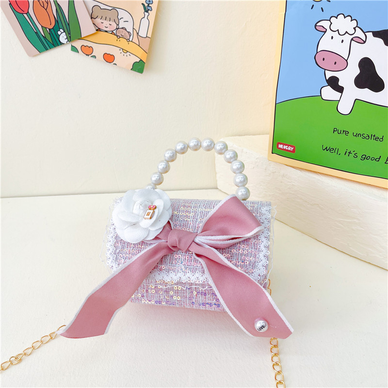 Bolso de los nuevos niños al por mayor bolso de princesa Linda pequeña flor arco accesorios bolsa versátil bolsa de mensajero de las muchachas