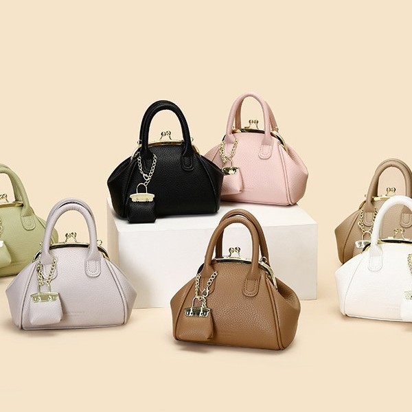 Venta al por mayor primavera y verano nuevo estilo bolso femenino retro bolso de clip bolso de mano moda todo fósforo bolso pequeño de mensajero de un solo hombro femenino