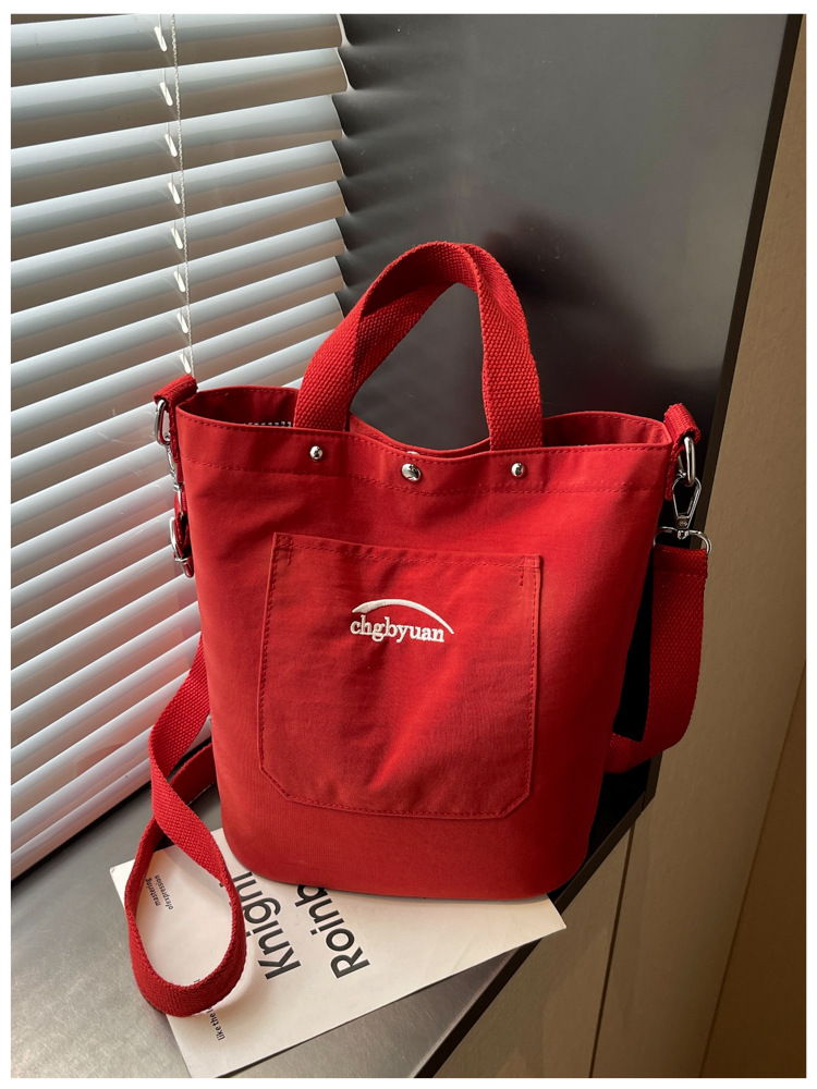 Bolso de mano de gran capacidad para mujeres 2026 verano nuevo estilo coreano simple mochila de hombro de viaje bolsa de ocio