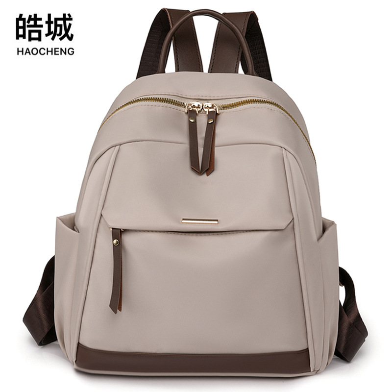 Fábrica al por mayor 2023 nueva mochila de nailon casual para mujer, mochila de viaje urbana simple de moda, mochila escolar