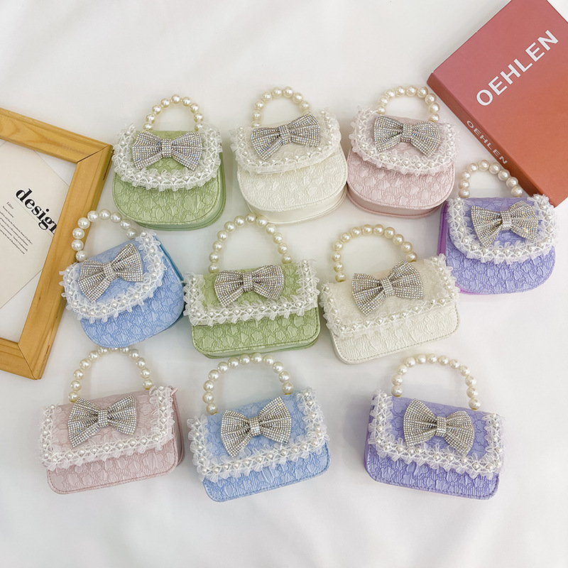 Bolsa de Niños de estilo coreano lindo arco perla Bolso pequeño princesa estilo occidental desgaste a juego joyería bolsa crossbody bolsa