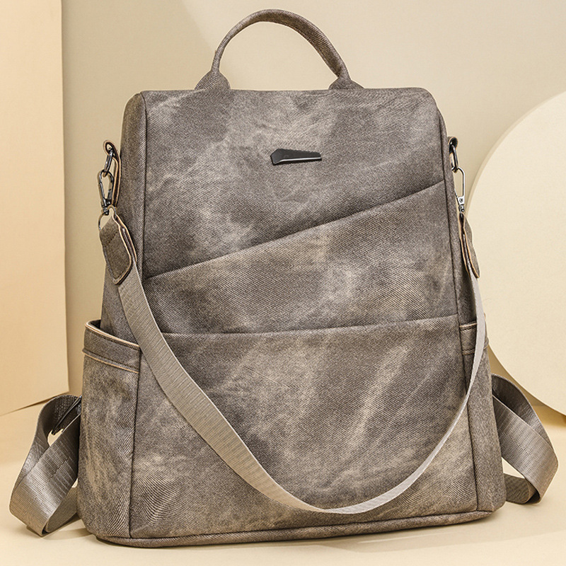 2024 nueva mochila antirrobo casual de color sólido para mujer simple retro al aire libre mochila de viaje ligero de doble uso marea