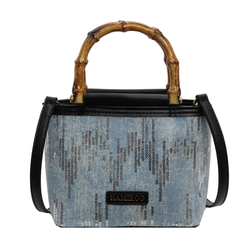 Bolso de mano de bambú para mujeres 2025 nuevo verano bolso de balde de vaquín coreano bolso de hombro mochila de moda