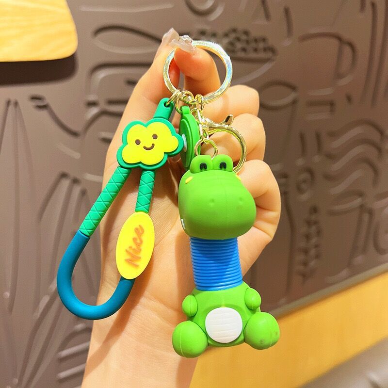 Llavero de cuello telescópico creativo de dibujos animados Divertido colgante de bolsa de descompresión colgante de coche cadena anillo pequeño regalo al por mayor