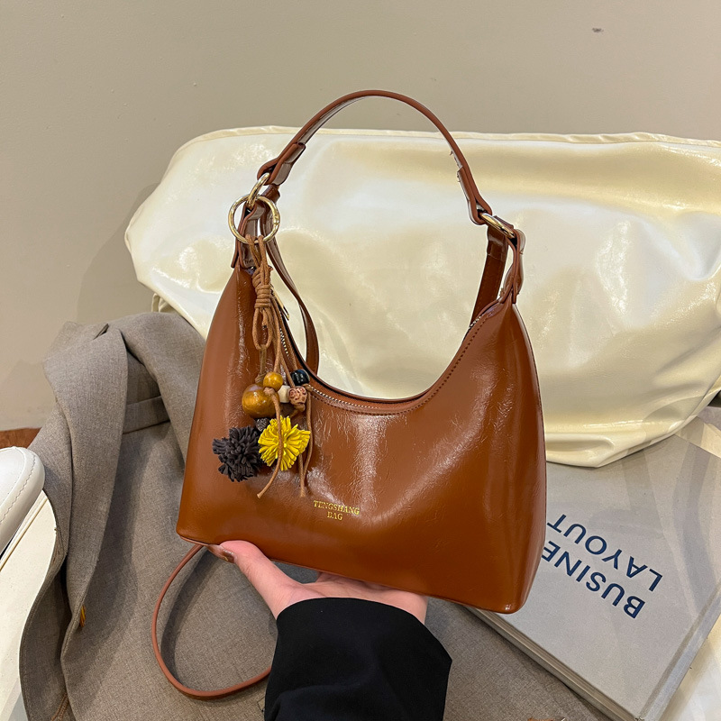 Bolsa de cena portátil de moda ligera de lujo, bolso de hombro de alta calidad de mujer, bolso de brazo de hombro de 2025 nuevo tipo de bolso de hombro de viaje