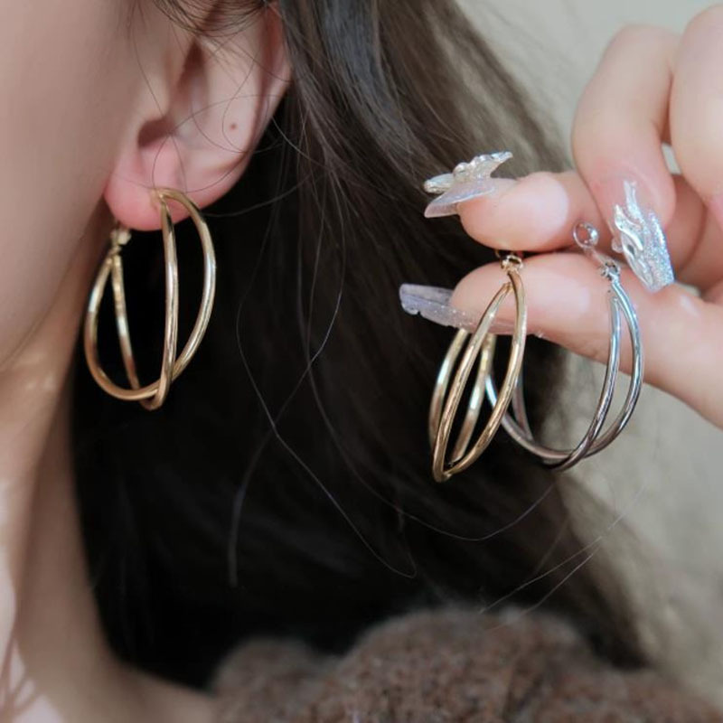 Vintage-style geometric cross hoop earrings, a touch of luxury and minimalism, embodying the "old money" aesthetic, creating a sophisticated and high-end look
