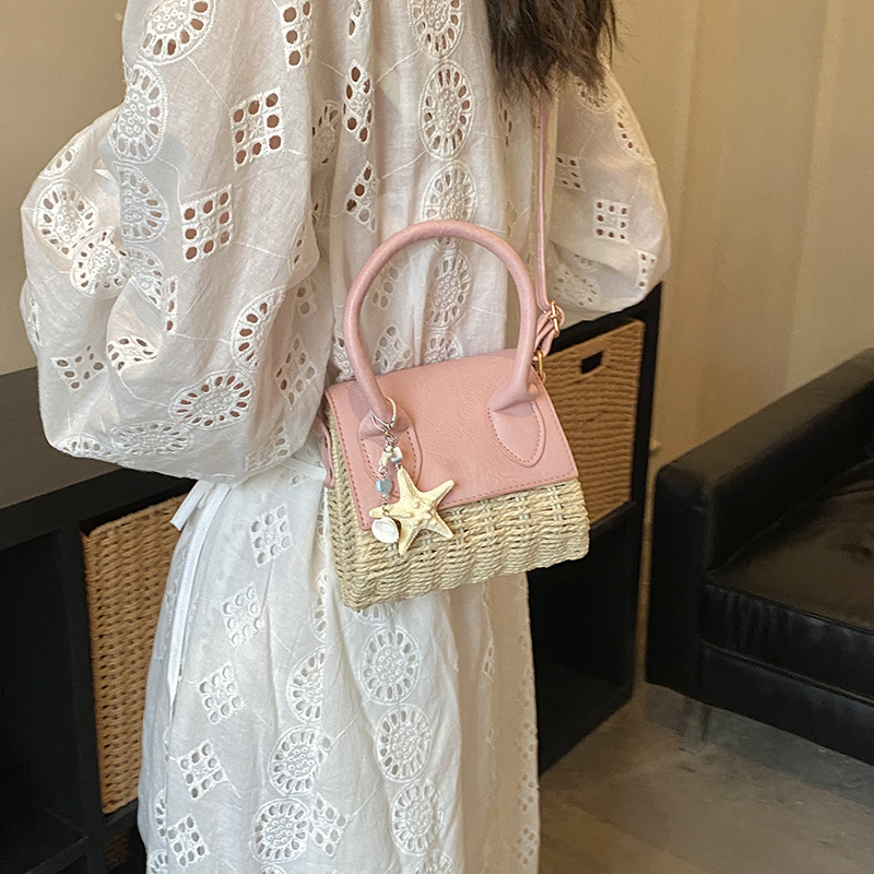 Mini bolso nuevo verano 2026 tela de paja de moda nicho sensación diaria bolso de hombro bolso de mochila