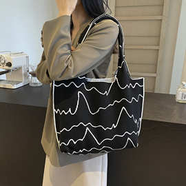 手提包编织女购物袋百搭通勤手提黑白大容量单肩包条纹休闲新花朵