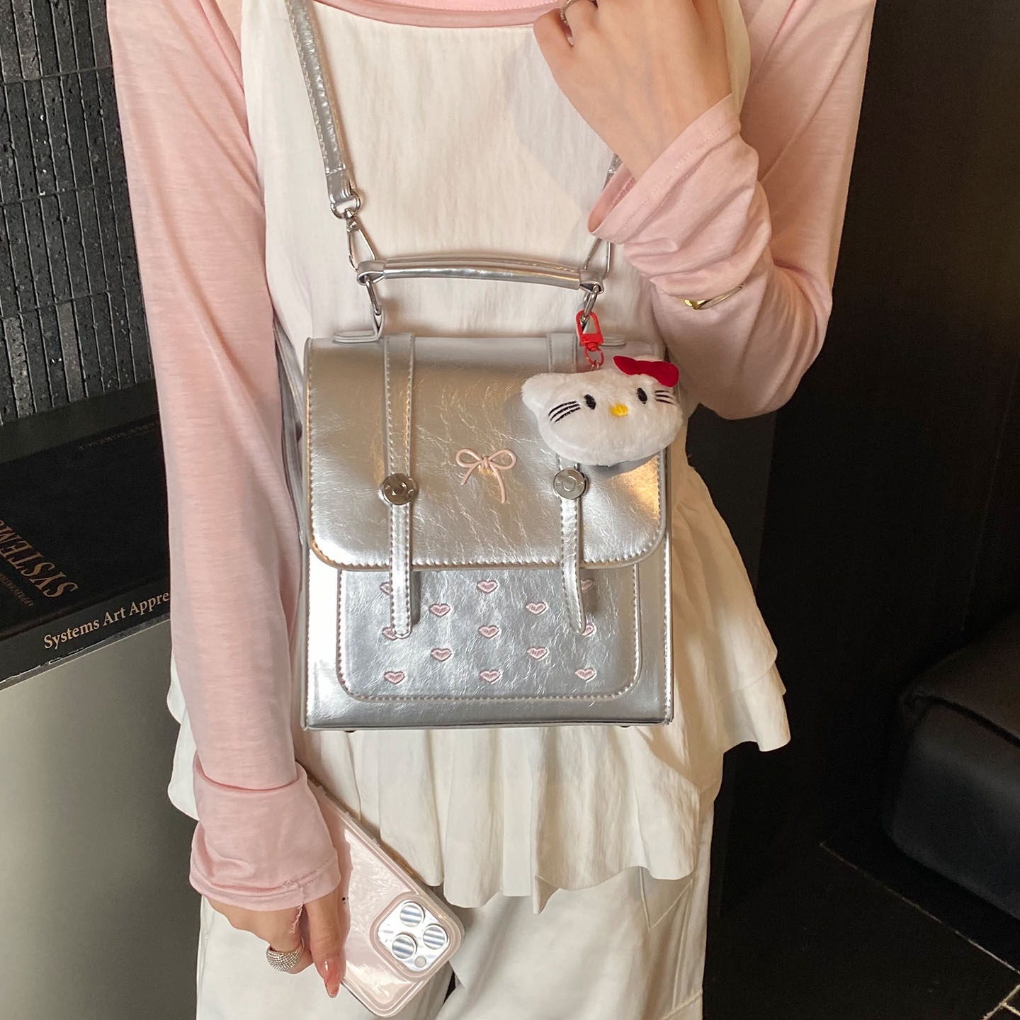 Estudiantes con cubierta de flip para mujeres nuevas lindas mochilas de verano 2026 colgantes coreanos temperamento mochila de gran capacidad dibujos animados