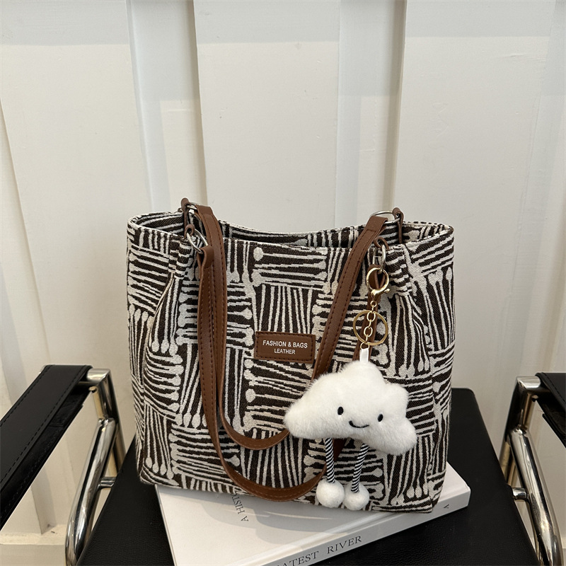 Bolso a rayas casual de todos los partidos de nicho para mujer 2024 nuevo bolso de hombro de gran capacidad de moda retro bolso de viaje