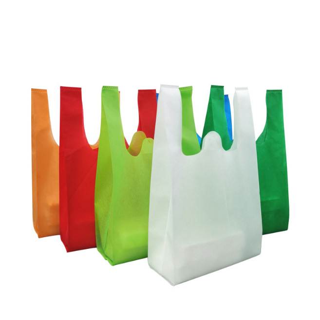 Bolsas de tela no tejida en stock bolsas de compras bolsas de chaleco impresión en color logotipo y patrón publicitario bolsas ecológicas
