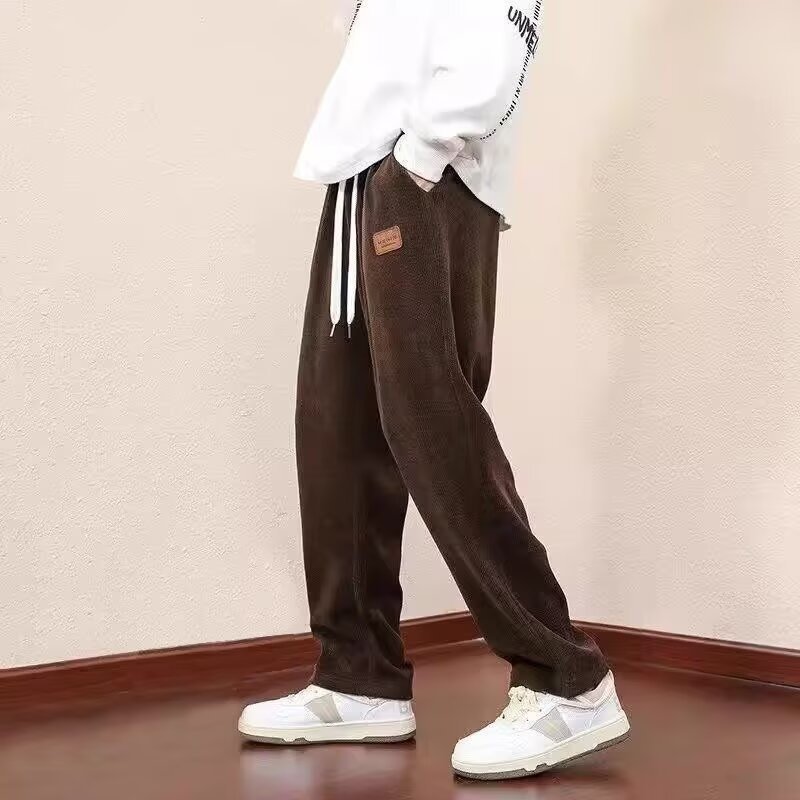 Pantalones casuales de cordillera para hombres otoño y invierno recto colgando pantalones de moda sueltos y pantalones deportivos de cordillera gruesos para hombres