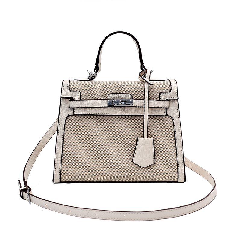 Bolso Kelly retro de alta gama para mujer, nuevo estilo transfronterizo de gran venta, patchwork de lino, colores contrastantes, bolso de hombro y bandolera.