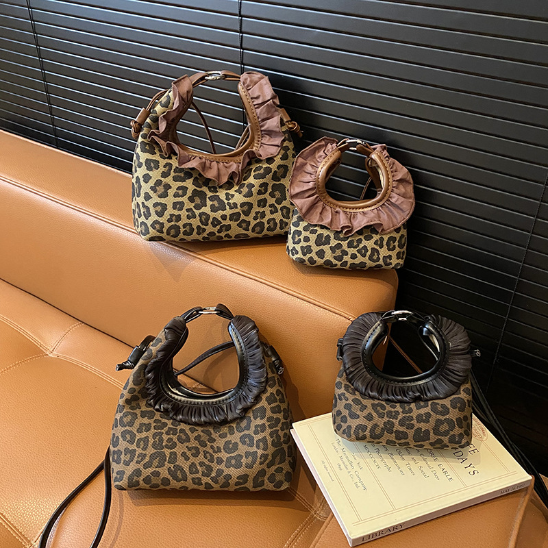 Moda coreana con patrón de leopardo para niñas bolsos de encaje exquisitos mini bolsos de hombro para bebés bolsos de comercio exterior transfronterizos para niños