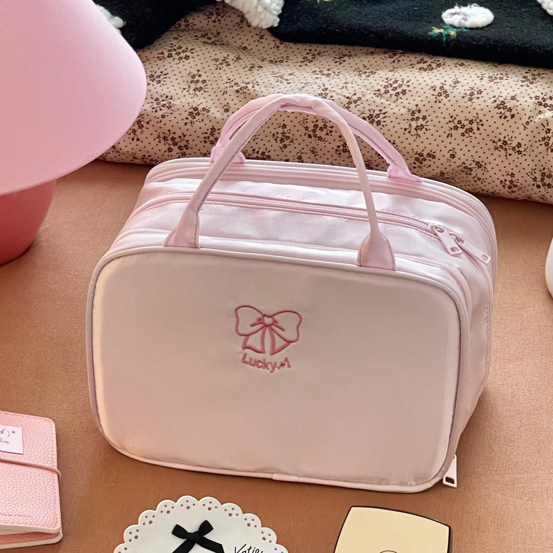 2025 nueva bolsa de maquillaje de tres capas de arco de viaje portátil multifuncional bolsa de lavado de gran capacidad de almacenamiento de cosméticos