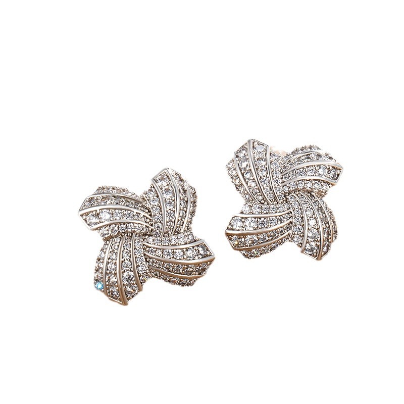 Xuping joyería aleación de cobre incrustación de piedras preciosas artificiales pernos de molino de viento mujer moda europea y americana pendientes de lujo ligero pernos