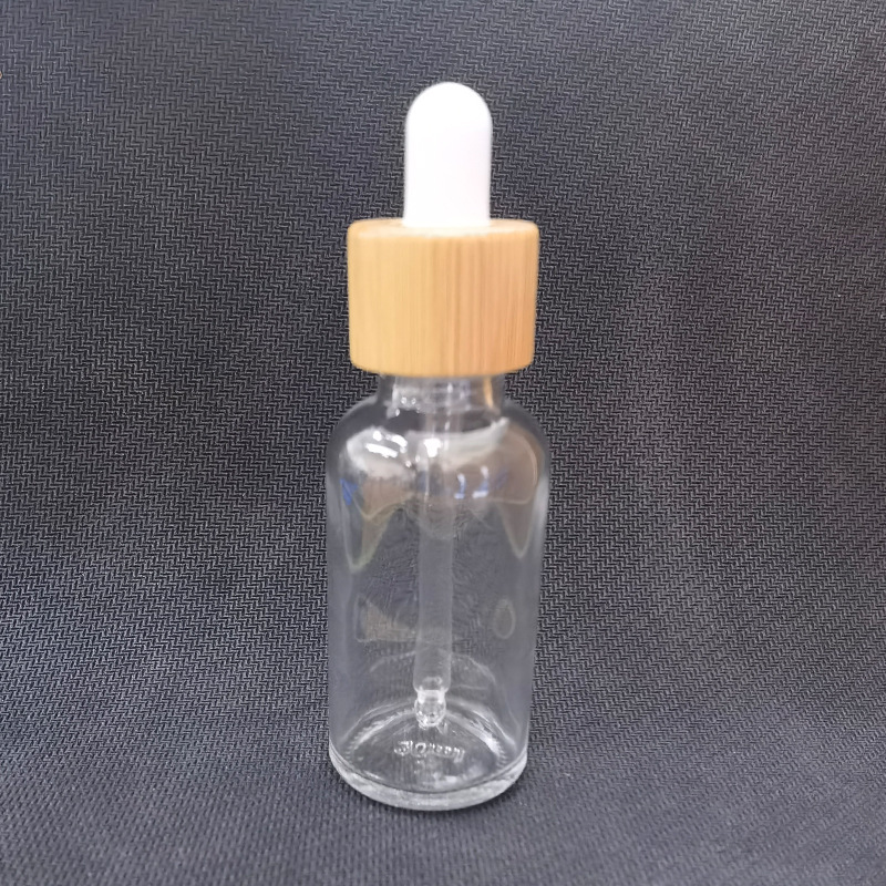 Cubierta de madera de bambú botella cosmética botella sub-botella esencia botella cuidado de la piel Paquete de envases de vidrio esmerilado botella cuentagotas botella de aceite esencial