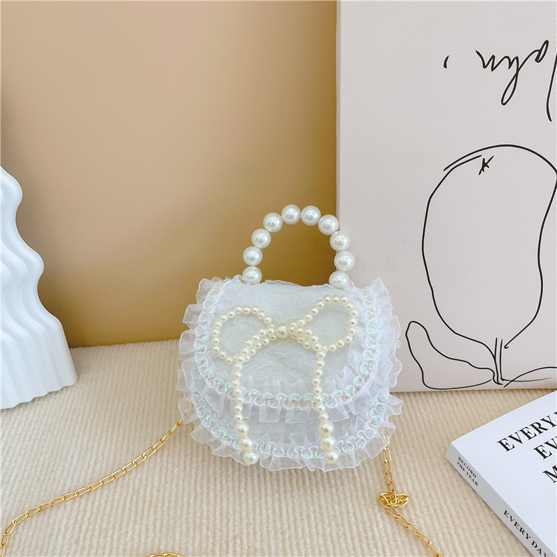 2022 nuevas niñas bolso de perlas de dibujos animados lindo arco princesa bolso de hombro estilo occidental encaje pequeño bolso de hombro