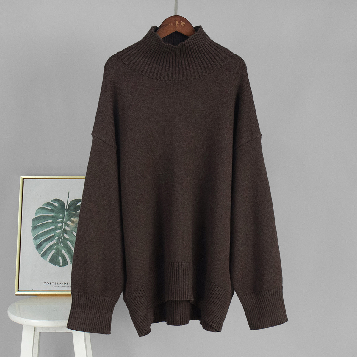 Suéter de cuello alto transfronterizo para mujeres 2025, Europa y los Estados Unidos de otoño y invierno explosivo color sólido jersey de punto de cuello alto suéter suelto para mujeres