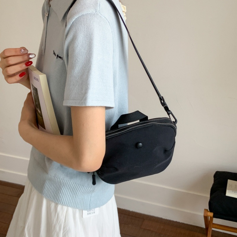 Bolsos pequeños de moda coreana 2025 verano nuevo estilo bolso femenino bolso de lona simple bolso de hombro casual bolso de mensajero con correa de hombro ancha