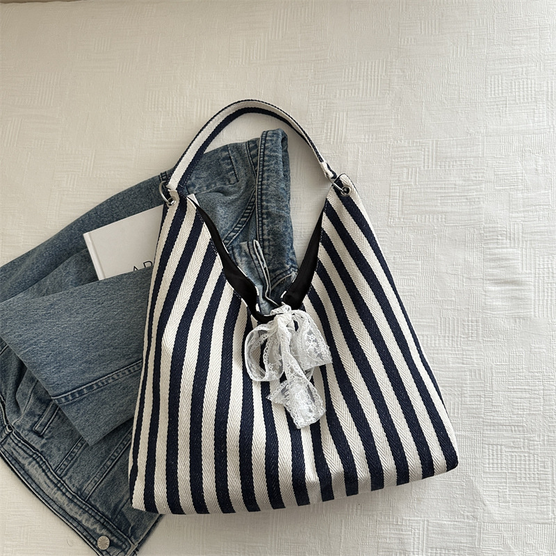 Bolsa de lona a rayas para mujeres verano 2024 nueva moda nicho coreano bolso especial bolso de tela de gran capacidad para estudiantes