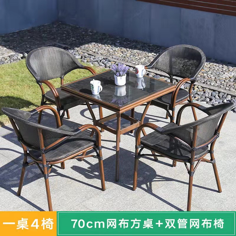 Mesa y silla al aire libre leche tienda de té cafetería silla de malla Silla de ratán Patio de tres piezas balcón mesa y silla de ocio al aire libre