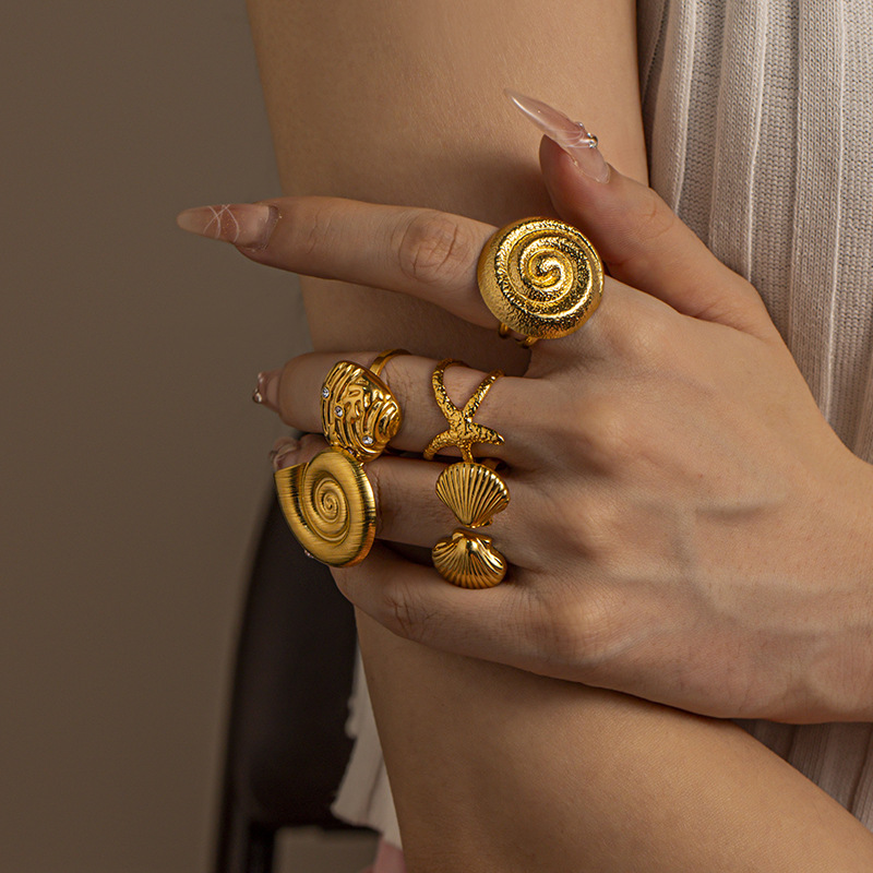 Anillo de acero inoxidable de oro de 18 quilates de TINA nicho de diseño de vacaciones marinas anillo de acero de titanio no se desvanece joyería