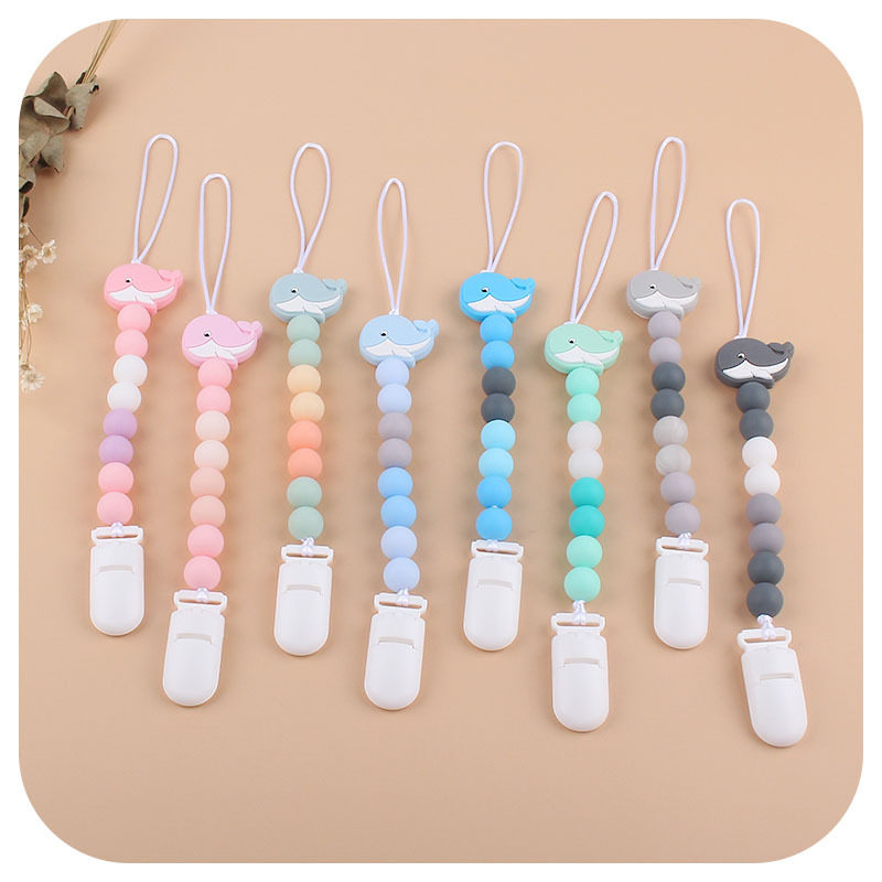 Amazon nuevo bebé ballena de silicona chupete Cadena de dientes de bebé Cadena de molienda calmante cadena anti-caída