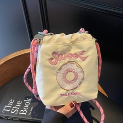 国境を越えた日系環境保護レジ袋かわいい布袋刺繍ドーナツ少女ハンドバッグはトートバッグにまたがっている