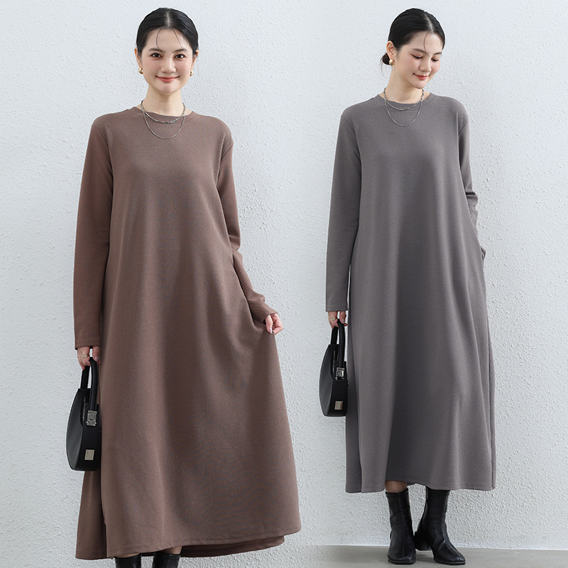 Literary style long simple dress autumn and winter solid color loose long sleeve pocket skirt design simple A- line long skirt