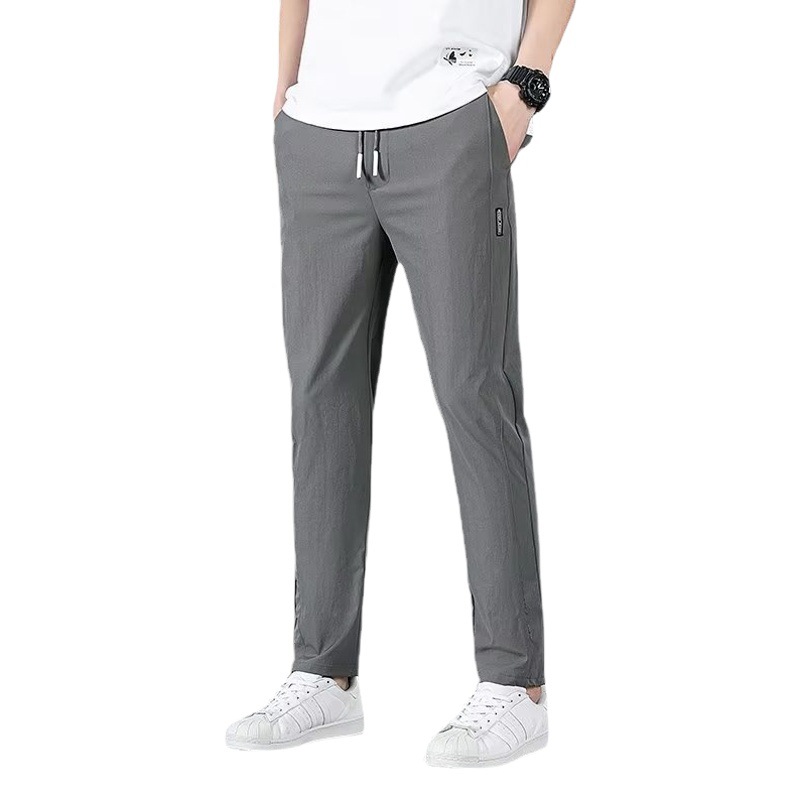 Camisa ropa Otoño e Invierno nueva etiqueta negra pantalones de terciopelo estilo coreano para hombres pantalones de punto de exportación de negocios engrosados de gran tamaño