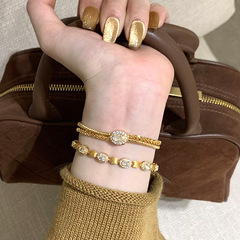 赤い本の爆発物は糸の金糸の腕輪のブレスレットの女性の高級な設計の金弦の線の柔らかい腕輪の工芸を巻いて柔らかい腕輪をかぶせます。