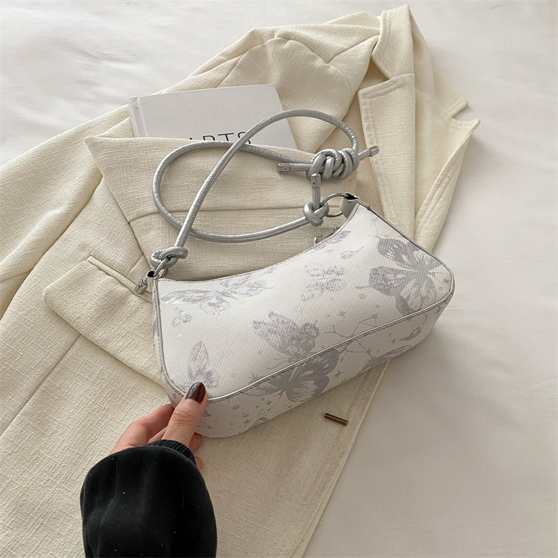 Bolso de diseño de nicho para mujeres 2024 nuevo estilo coreano lindo bolso de brazo portátil para mujeres sensación de alta calidad de una sola mochila de hombro de moda