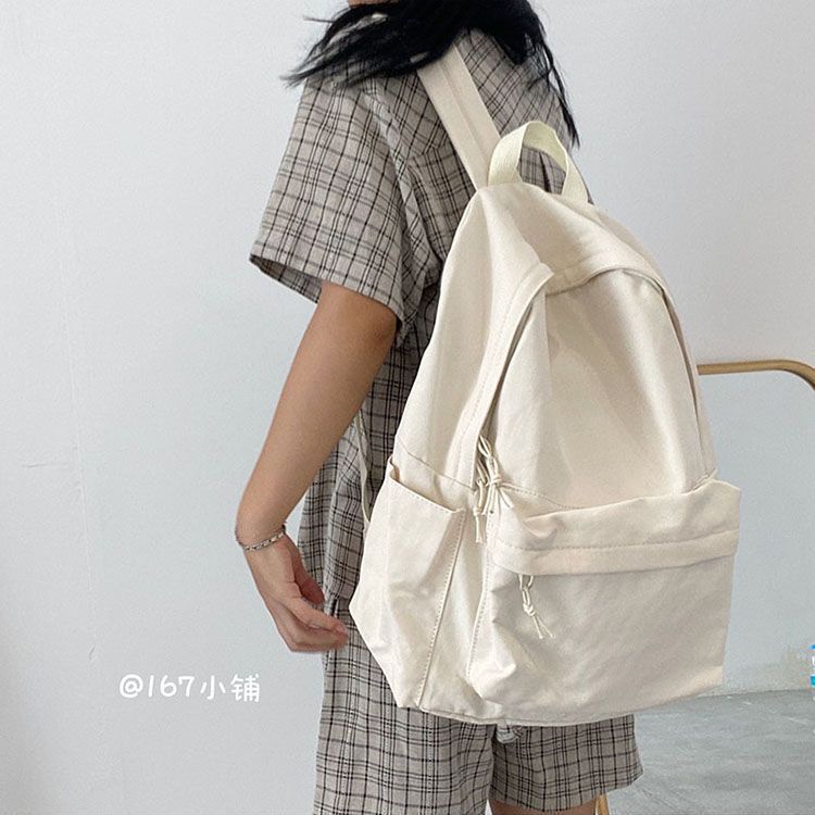 高校の学生の純色のカバンの女性ins森系の百合大学のキャンパスのシンプルな中学生のキャンバスのリュックサック|undefined