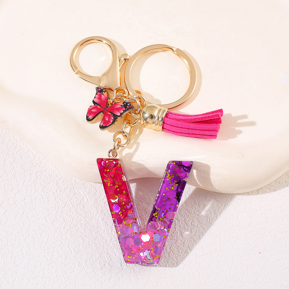 Transfronterizo Amazon 26 letras llavero de goteo de goma esquinilla gradiente letras mariposa llavero bolso de mujer colgante